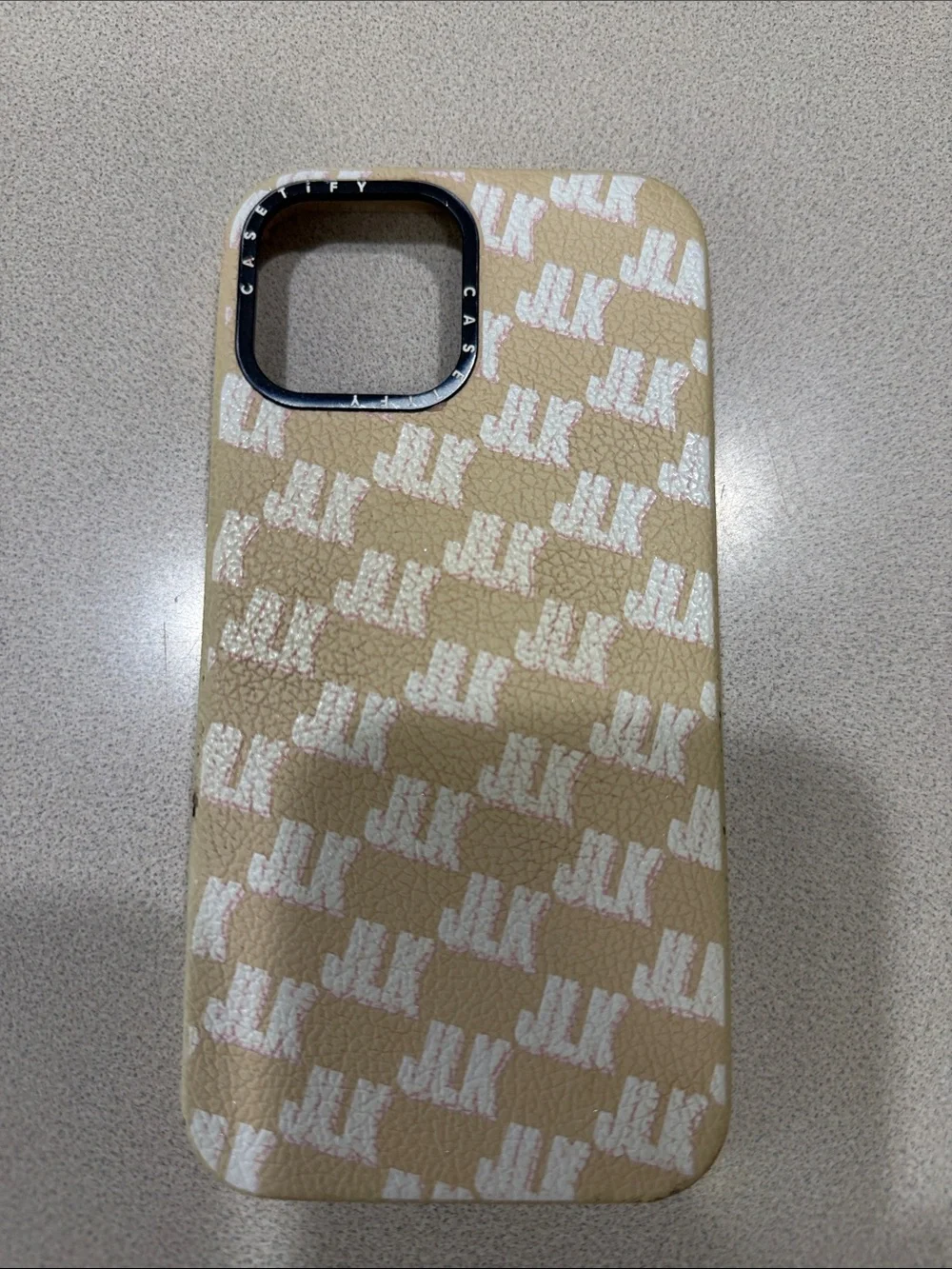 Casetify Beige Monogram iPhone Case with White Logo Pattern
